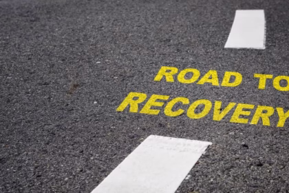 road to recovery text on road in capital latters